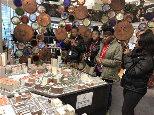 students looking at model city 